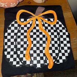Black and White Checkered Pumpkin Shirt with Orange Bow